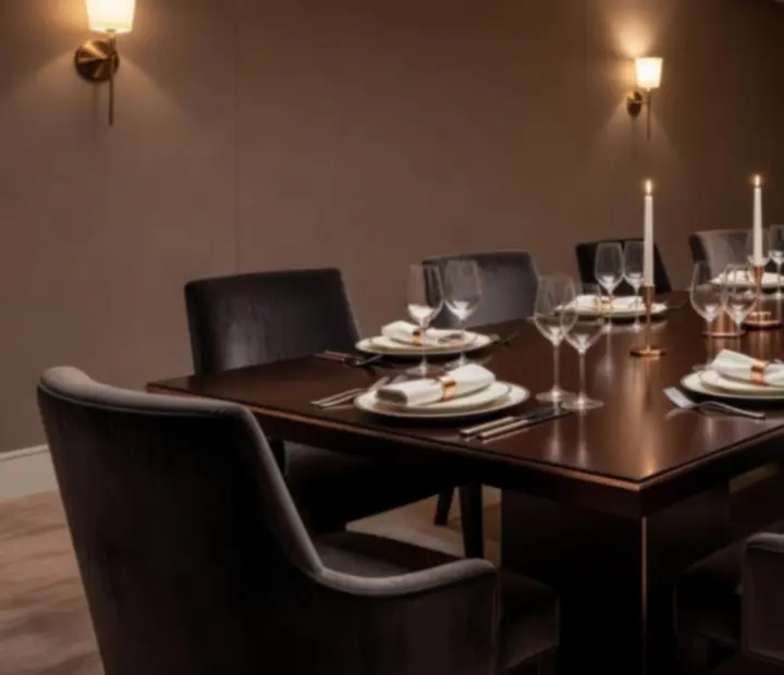 Private dining room set for an intimate event with candlelit tables
